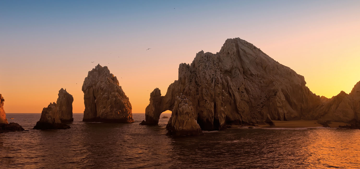 Explore stunning rock formations on a Central America yacht charter at sunset